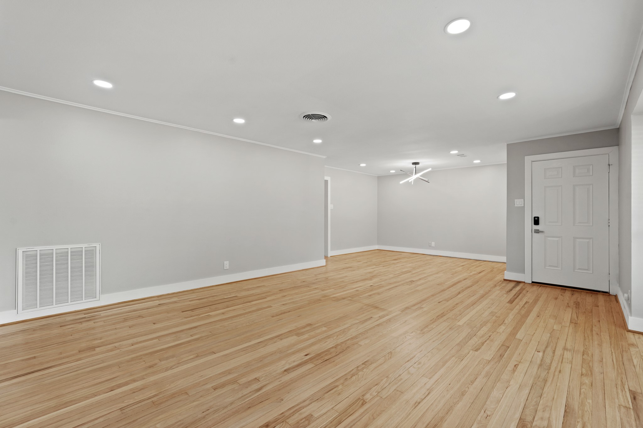 5451 Redstart Street Houston, TX 77096 - Photo 5 of 23 a view of an empty room with wooden floor