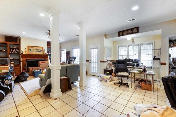 167 Edgewater Drive Temple, GA 30179 - Photo 26 of 37 a living room with furniture a fireplace and a flat screen tv