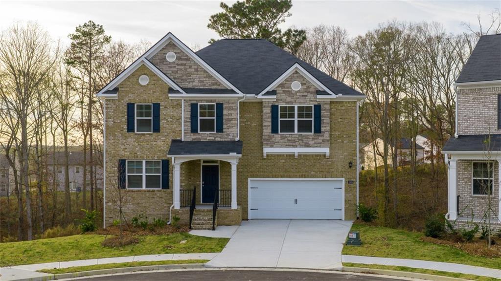 504 Bullock Pass Jefferson, GA 30549 - Photo 1 of 54 a view of a white house with large windows and a yard