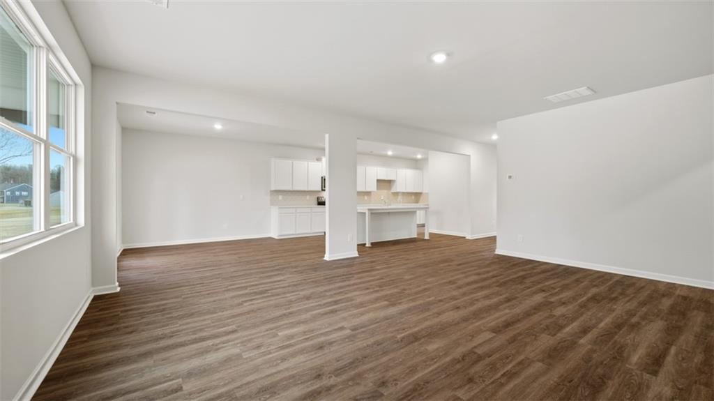 504 Bullock Pass Jefferson, GA 30549 - Photo 22 of 54 a view of empty room with wooden floor and window