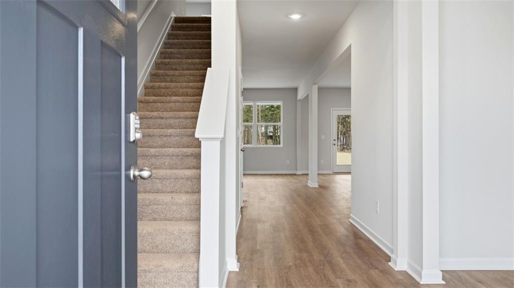 504 Bullock Pass Jefferson, GA 30549 - Photo 3 of 54 a view of a hallway with wooden floor and entryway
