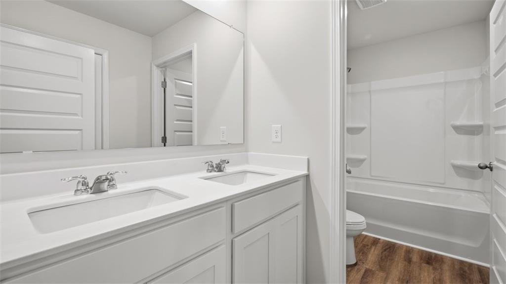 504 Bullock Pass Jefferson, GA 30549 - Photo 45 of 54 a bathroom with a sink and a bathtub