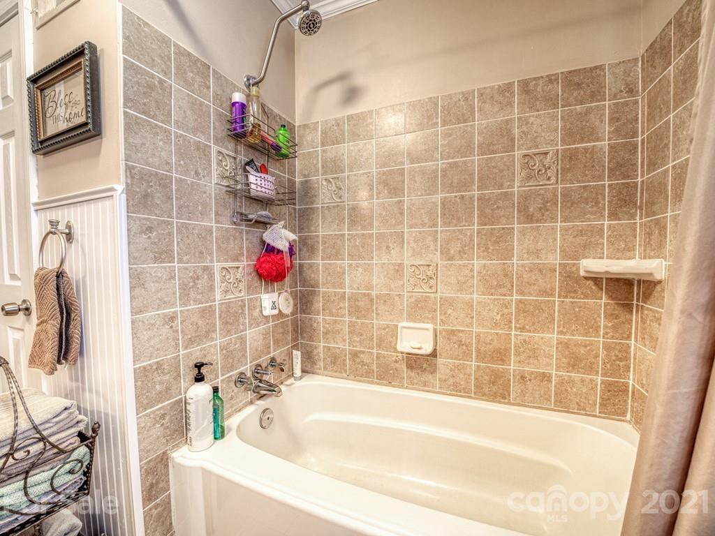 2823 Bettis Road Grover, NC 28073 - Photo 16 of 27 a bathroom with a bathtub and shower