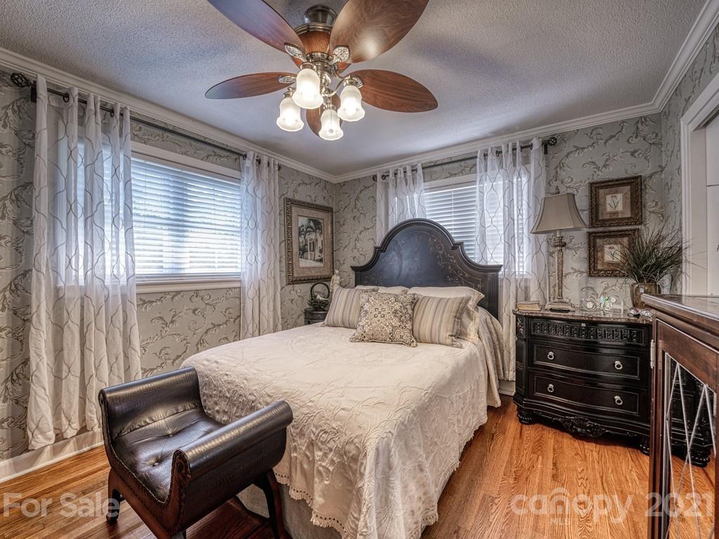 2823 Bettis Road Grover, NC 28073 - Photo 19 of 27 a bedroom with a bed and wooden floor