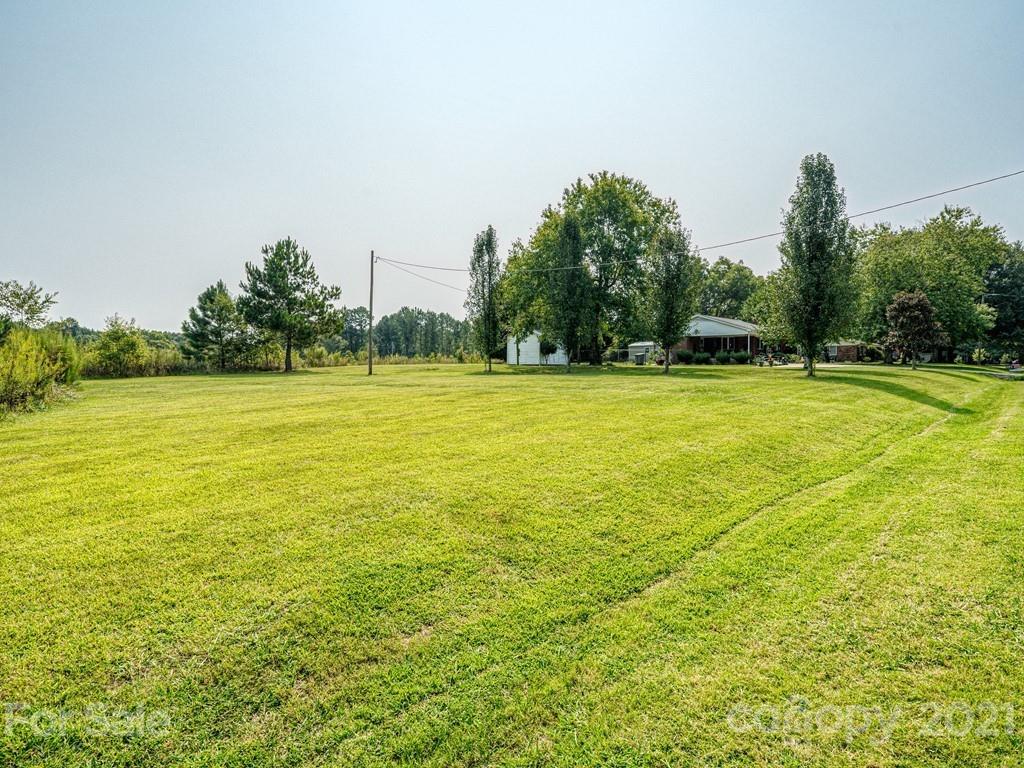 2823 Bettis Road Grover, NC 28073 - Photo 26 of 27 a view of a large yard with a large trees