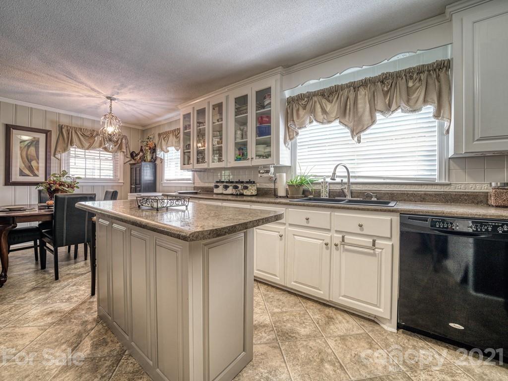 2823 Bettis Road Grover, NC 28073 - Photo 6 of 27 a kitchen with granite countertop a sink stove and cabinets