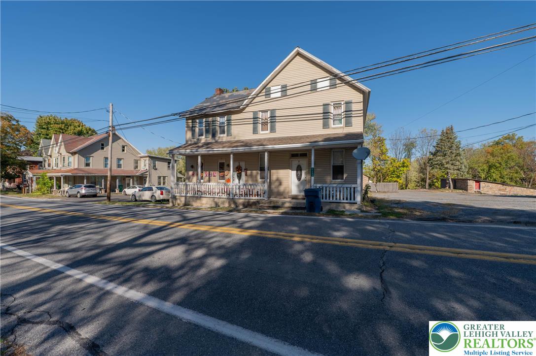 1261 State Street, Unit C Mertztown, PA 19539 - Photo 1 of 13 a front view of a house with a yard
