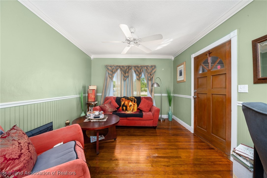 1612 Hitakee Avenue Sebring, FL 33870 - Photo 3 of 32 a living room with furniture and a wooden floor