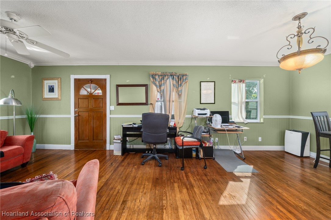 1612 Hitakee Avenue Sebring, FL 33870 - Photo 7 of 32 a living room with furniture and a wooden floor