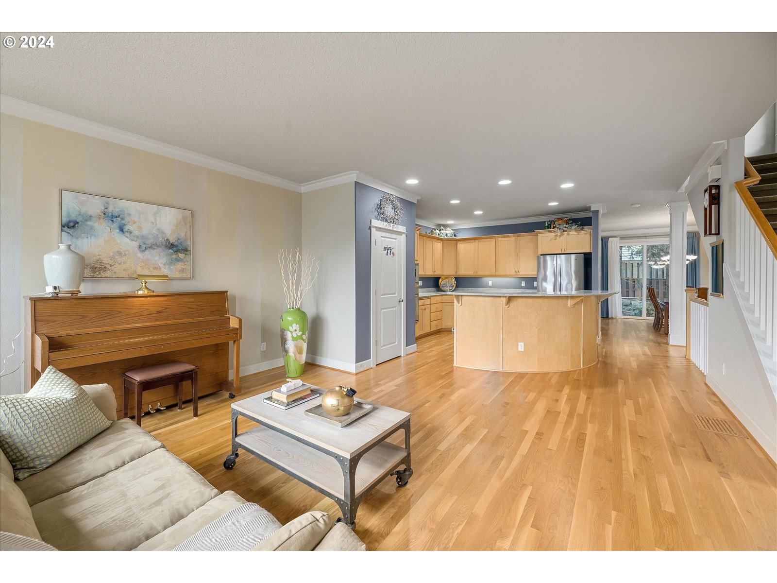 2224 Lucerne Place West Linn, OR 97068 - Photo 15 of 26 a living room with furniture and a dining table with wooden floor