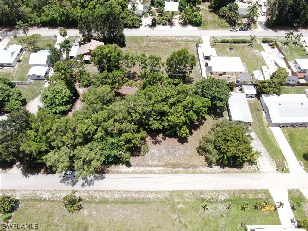 5855 Sailfish Road Bokeelia, FL 33922 - Photo 5 of 9 an aerial view of residential houses with yard