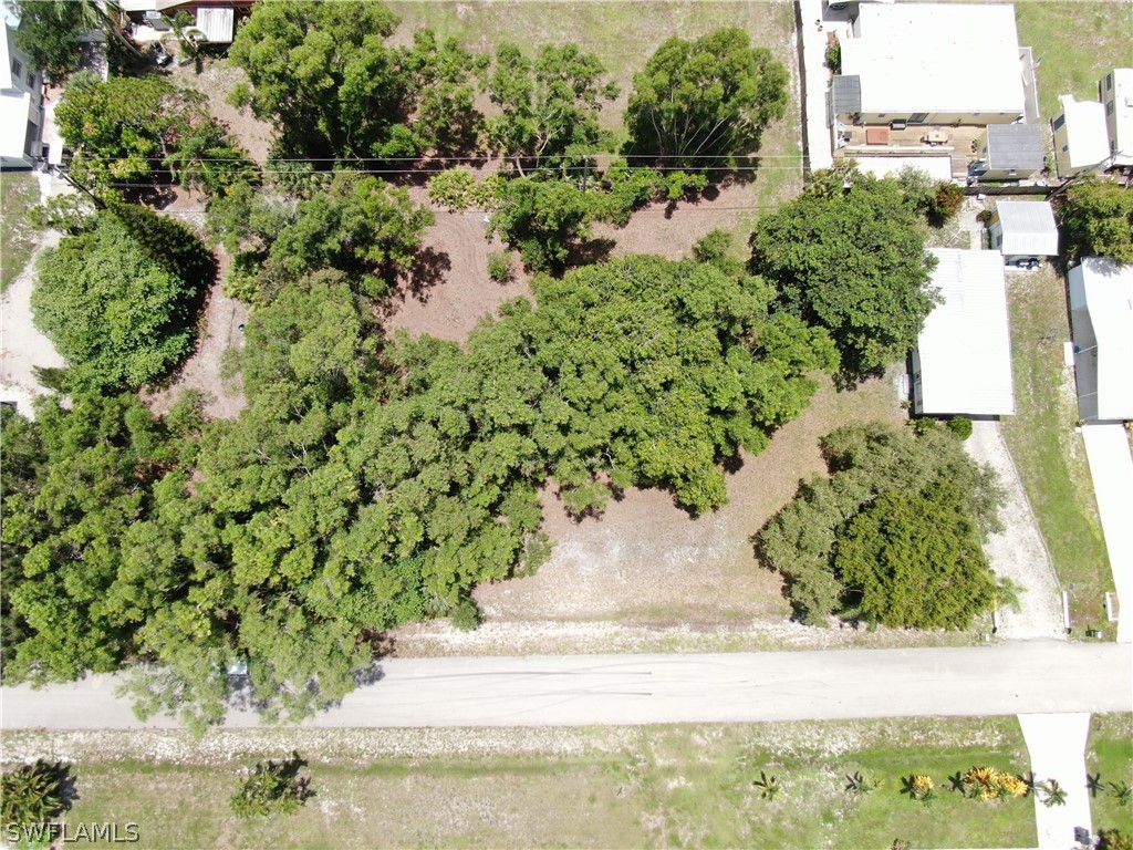 5855 Sailfish Road Bokeelia, FL 33922 - Photo 6 of 9 an aerial view of residential house with car parked