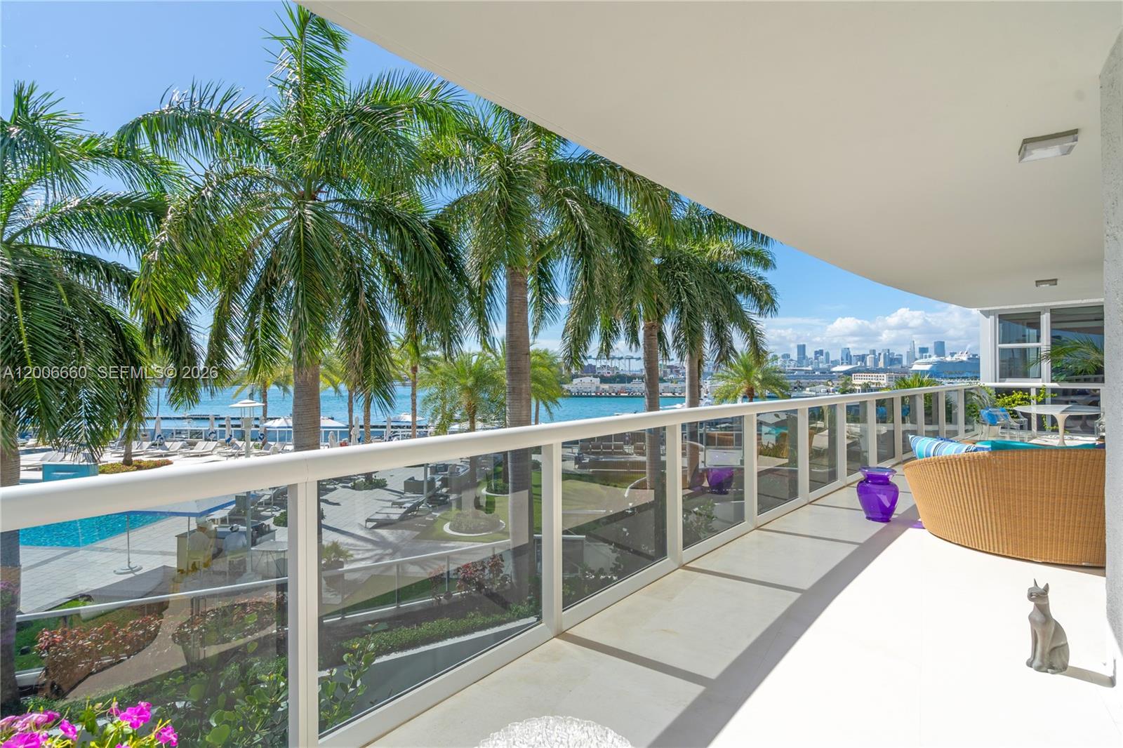 400 Alton Road, Unit 706 Miami Beach, FL 33139 - Photo 15 of 15 a view of a balcony with palm trees