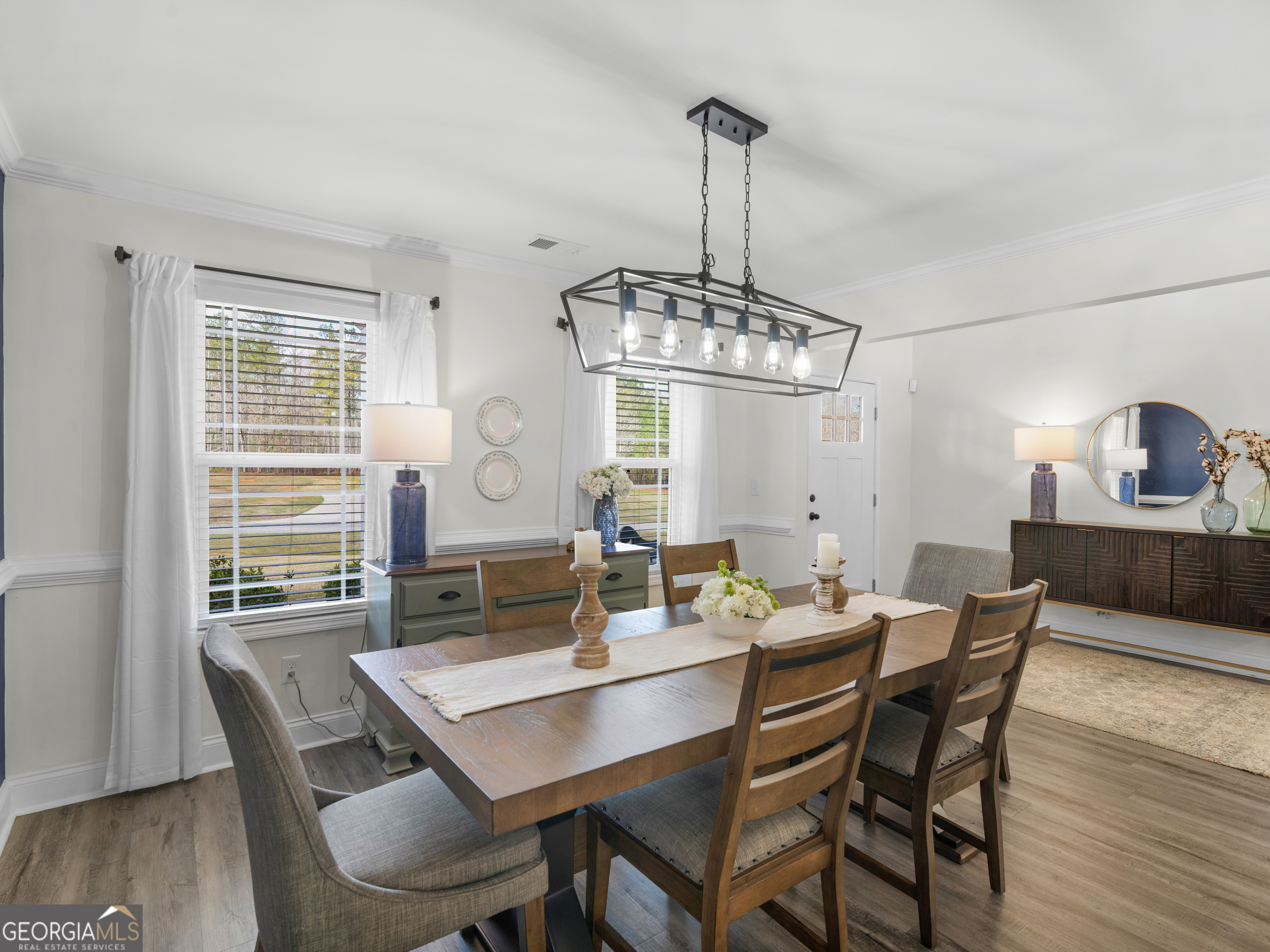 119 Mylee Cove Barnesville, GA 30204 - Photo 14 of 57 a view of a dining room with furniture window and wooden floor