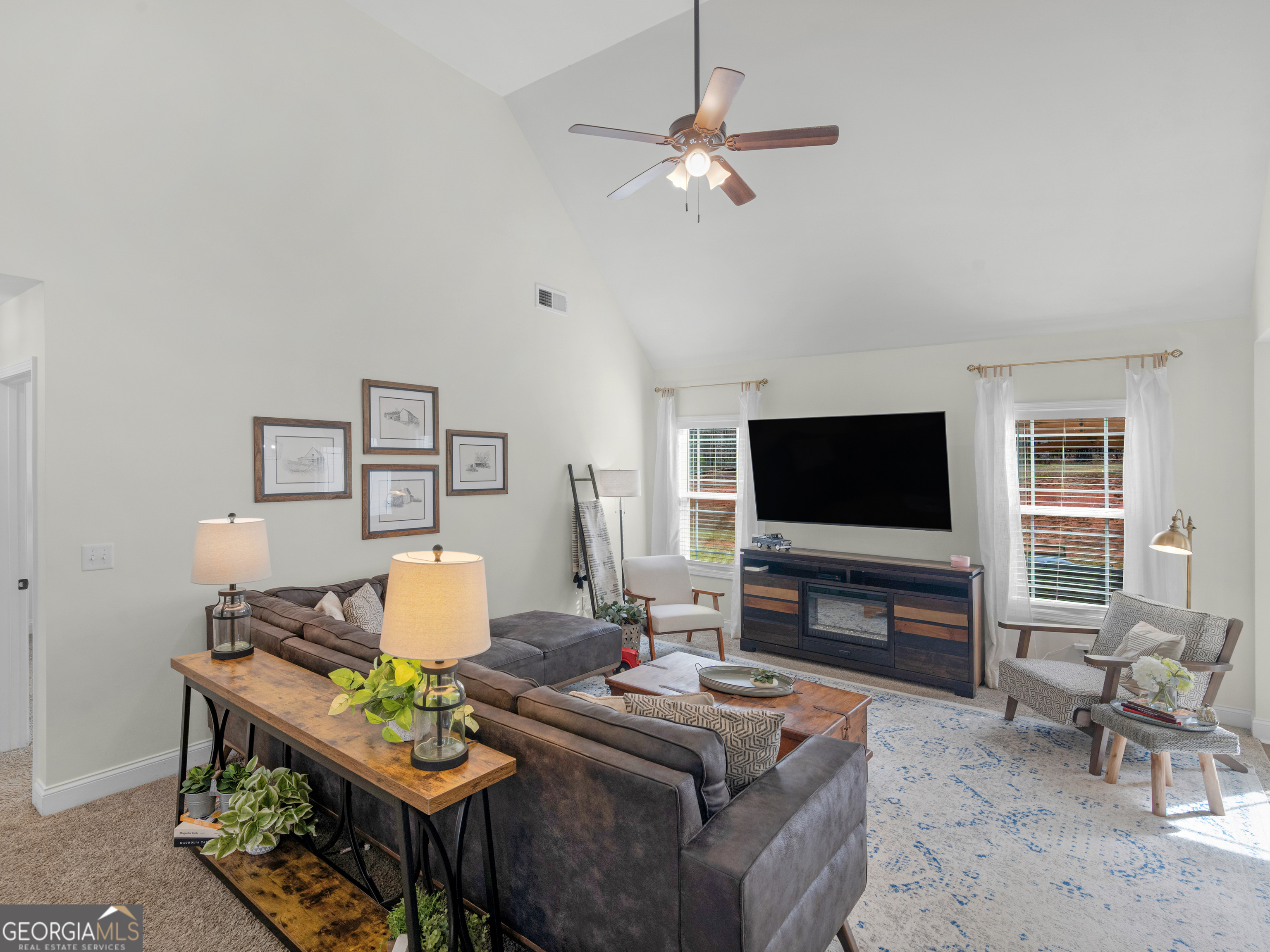 119 Mylee Cove Barnesville, GA 30204 - Photo 15 of 57 a living room with furniture and a flat screen tv