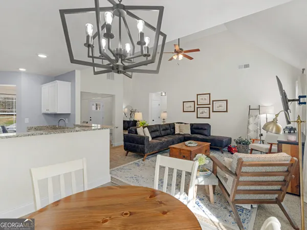 a kitchen with stainless steel appliances a refrigerator and a stove top oven