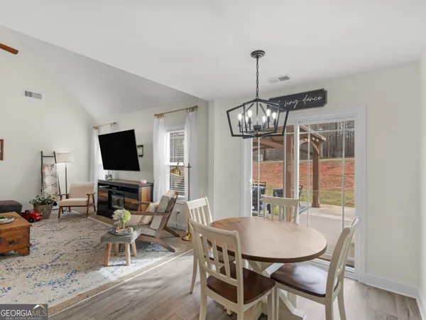 a kitchen with stainless steel appliances granite countertop a refrigerator a stove top oven a sink and dishwasher