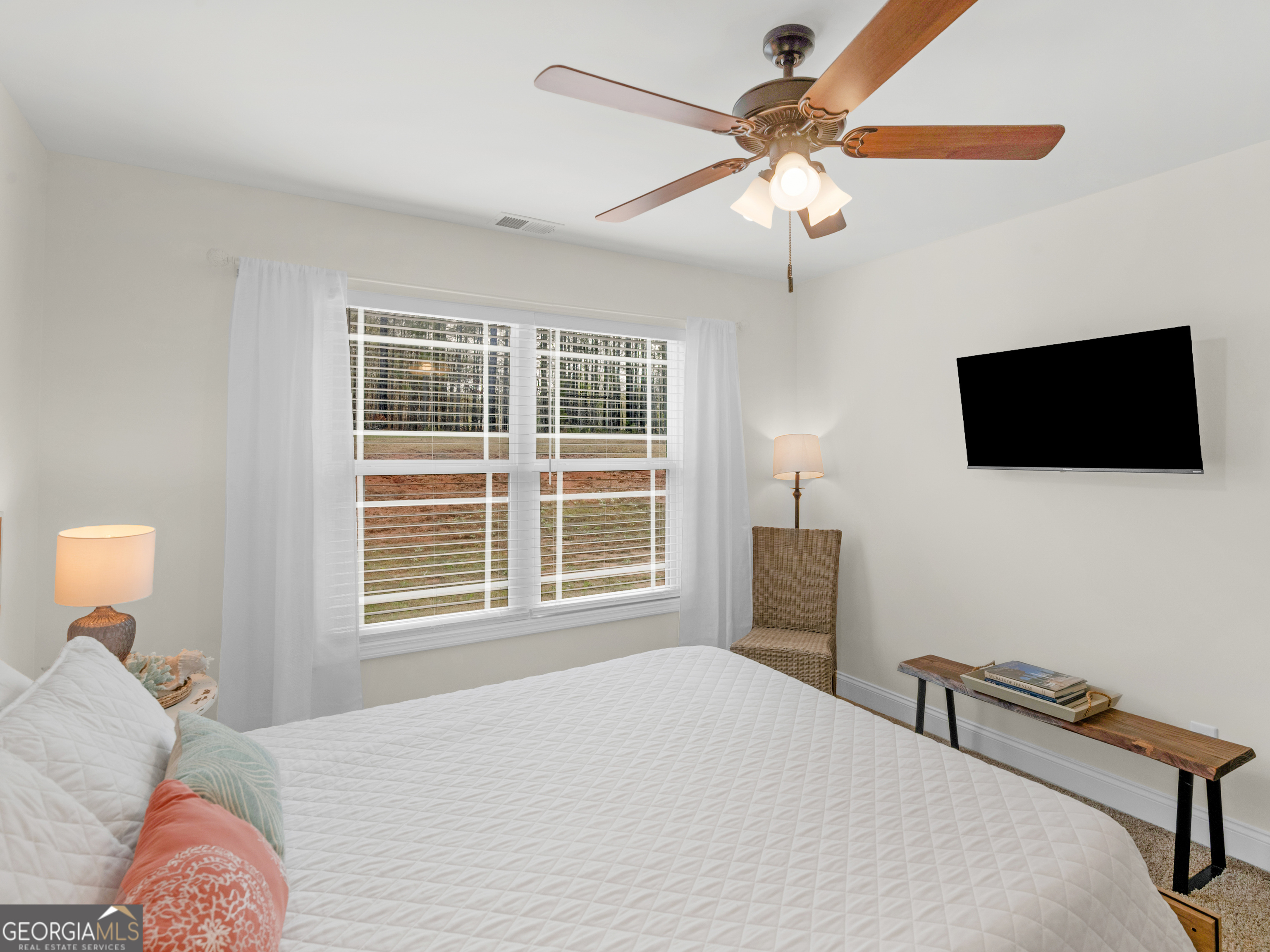 119 Mylee Cove Barnesville, GA 30204 - Photo 40 of 57 a bedroom with a bed and a flat screen tv