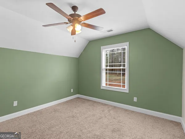 a house view with a sitting space and garden space