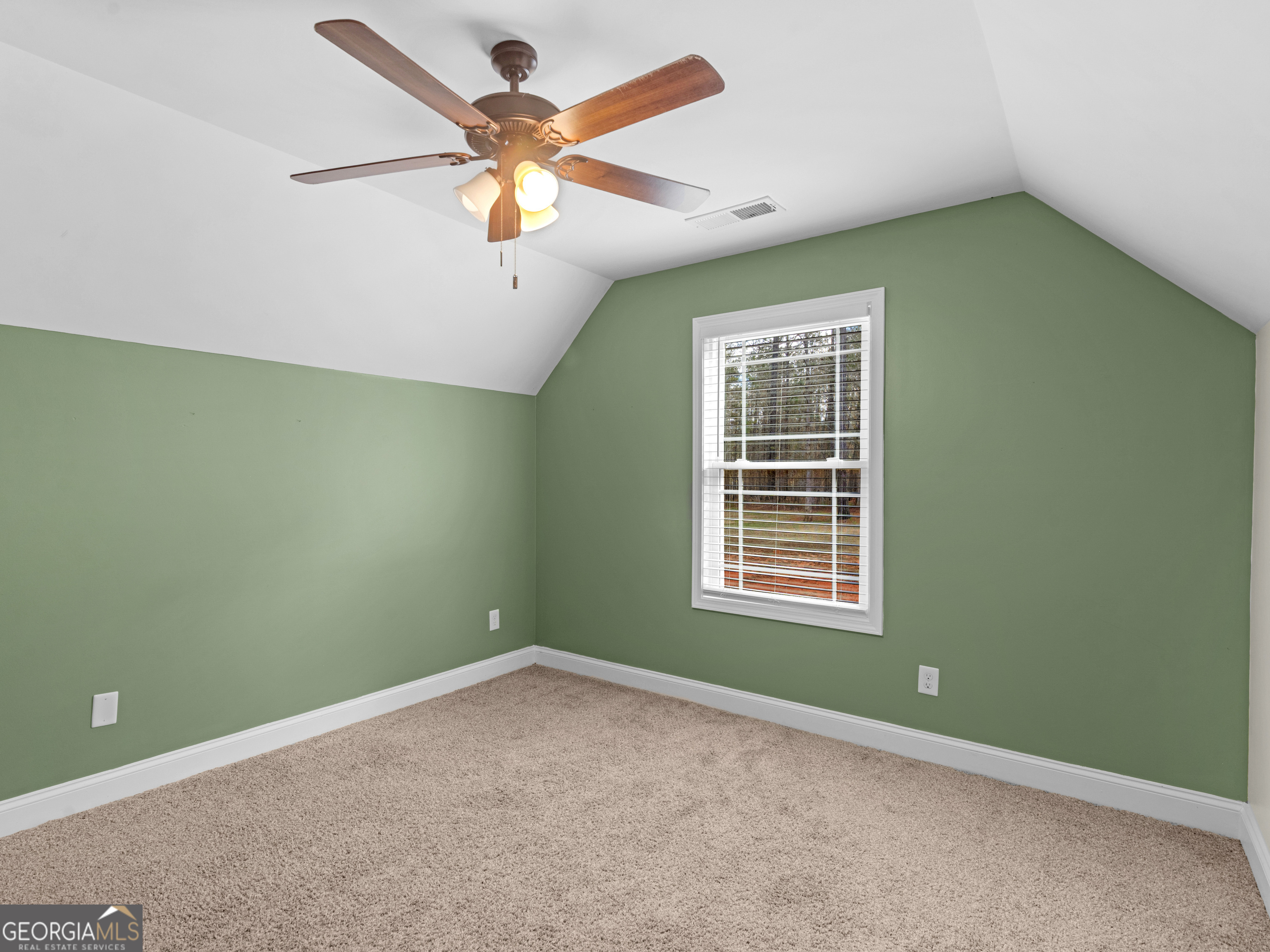 119 Mylee Cove Barnesville, GA 30204 - Photo 48 of 57 an empty room with a window and a fan