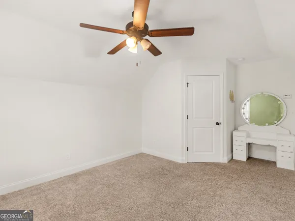 an aerial view of a house with swimming pool