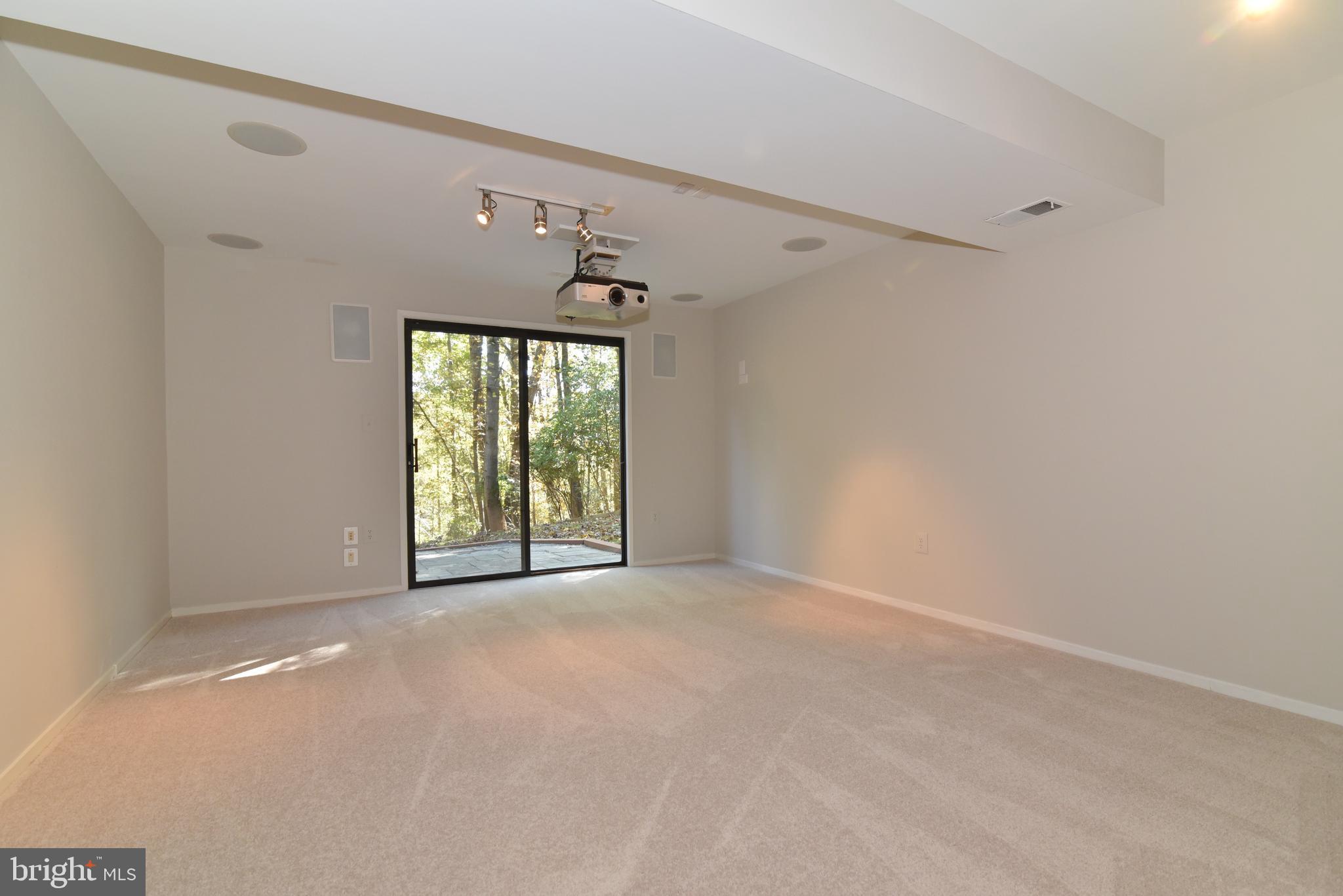 11117 Glade Drive Reston, VA 20191 - Photo 58 of 75 The Rec Room leads to the back stone patio & yard.