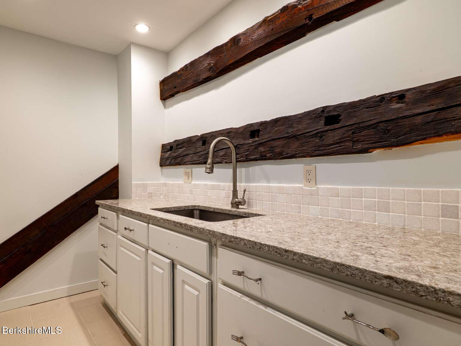 160 High Street Lee, MA 01238 - Photo 33 of 41 a kitchen with granite countertop a sink and cabinets