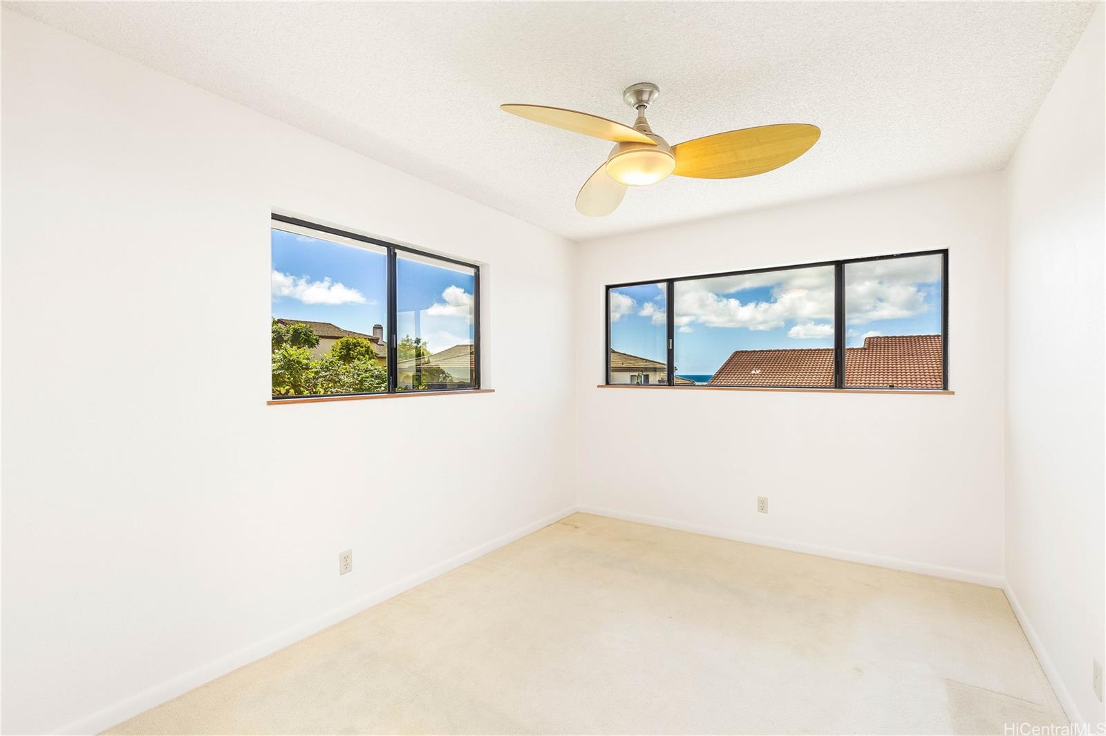98-1421 Onikiniki Place, Unit 5 Aiea, HI 96701 - Photo 16 of 25 a view of a room with a large window
