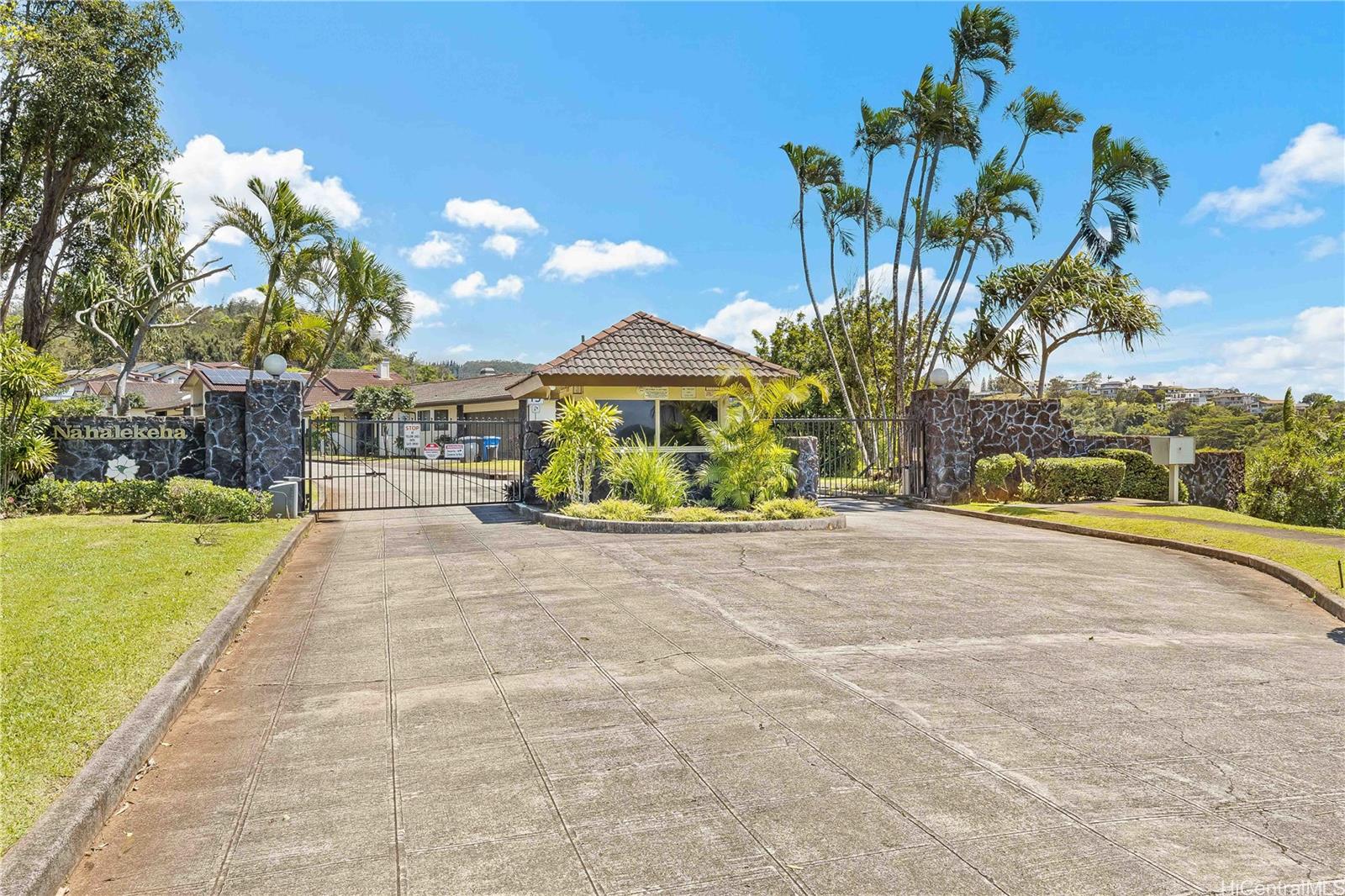 98-1421 Onikiniki Place, Unit 5 Aiea, HI 96701 - Photo 22 of 25 a house with garden in front of it