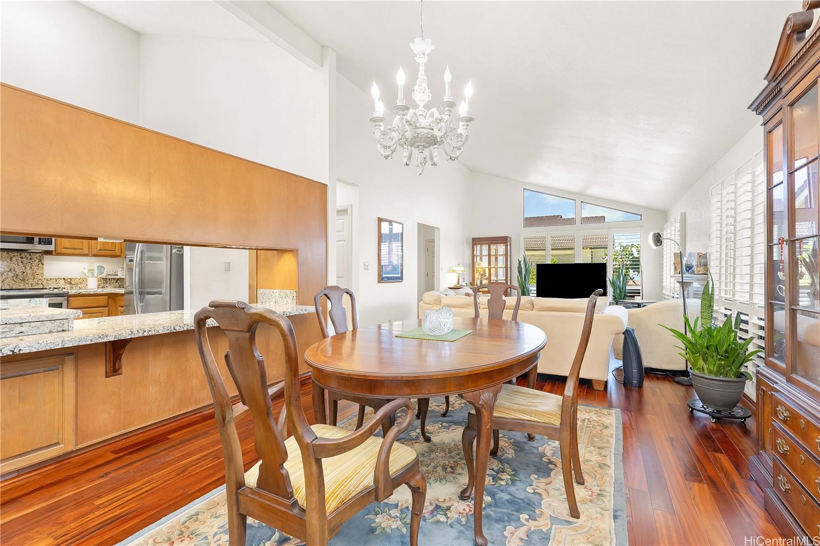 98-1421 Onikiniki Place, Unit 5 Aiea, HI 96701 - Photo 6 of 25 a view of a dining room with furniture window and wooden floor