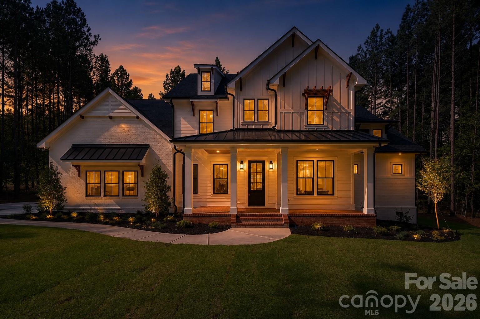 a front view of a house with a garden and fire pit