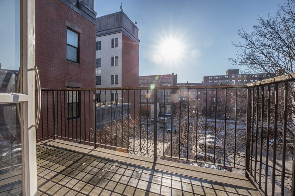 86 West Springfield Street, Unit 3 Boston, MA 02118 - Photo 11 of 12 a view of a balcony with wooden fence
