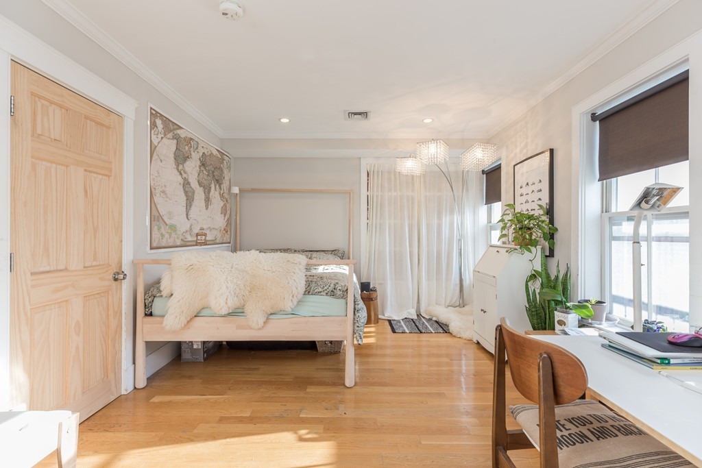 86 West Springfield Street, Unit 3 Boston, MA 02118 - Photo 4 of 12 a living room with furniture and a large window