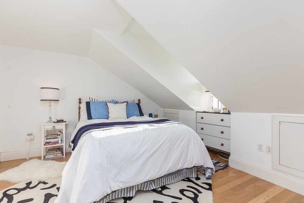 86 West Springfield Street, Unit 3 Boston, MA 02118 - Photo 8 of 12 a bedroom with a bed and a cabinets