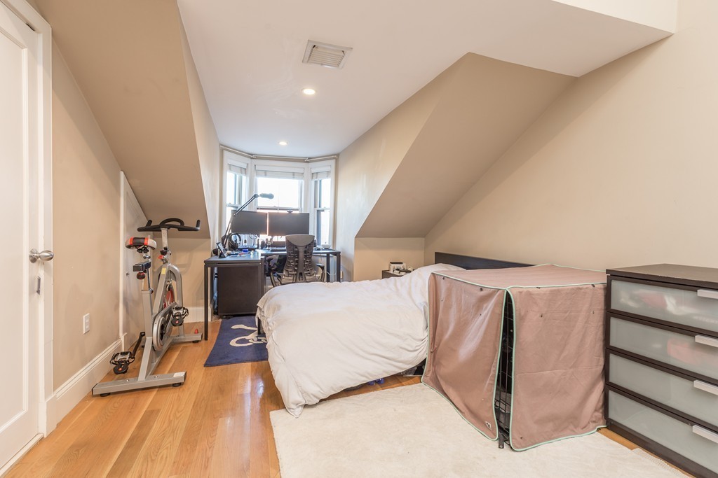 86 West Springfield Street, Unit 3 Boston, MA 02118 - Photo 9 of 12 a living room with a couch and a table with wooden floor