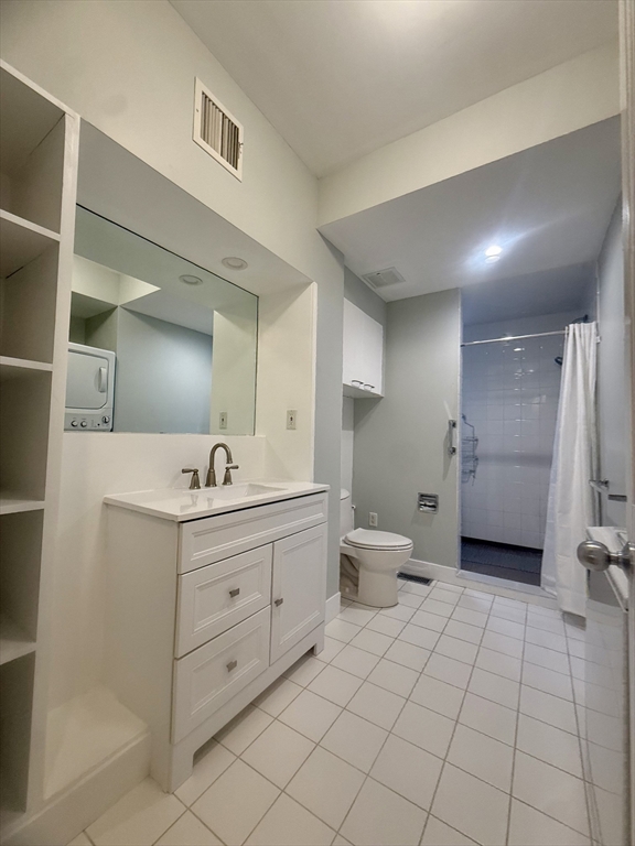 172 Maplewood Street, Unit 172 Watertown, MA 02472 - Photo 14 of 29 a bathroom with a toilet sink and mirror