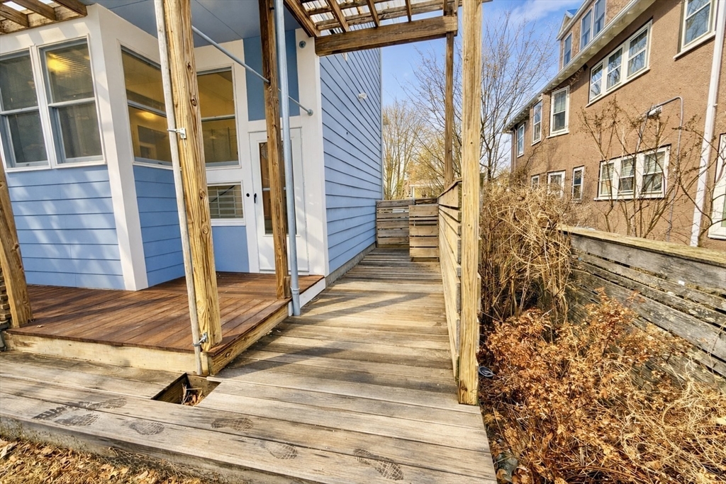 172 Maplewood Street, Unit 172 Watertown, MA 02472 - Photo 28 of 29 a view of a brick building with wooden floor