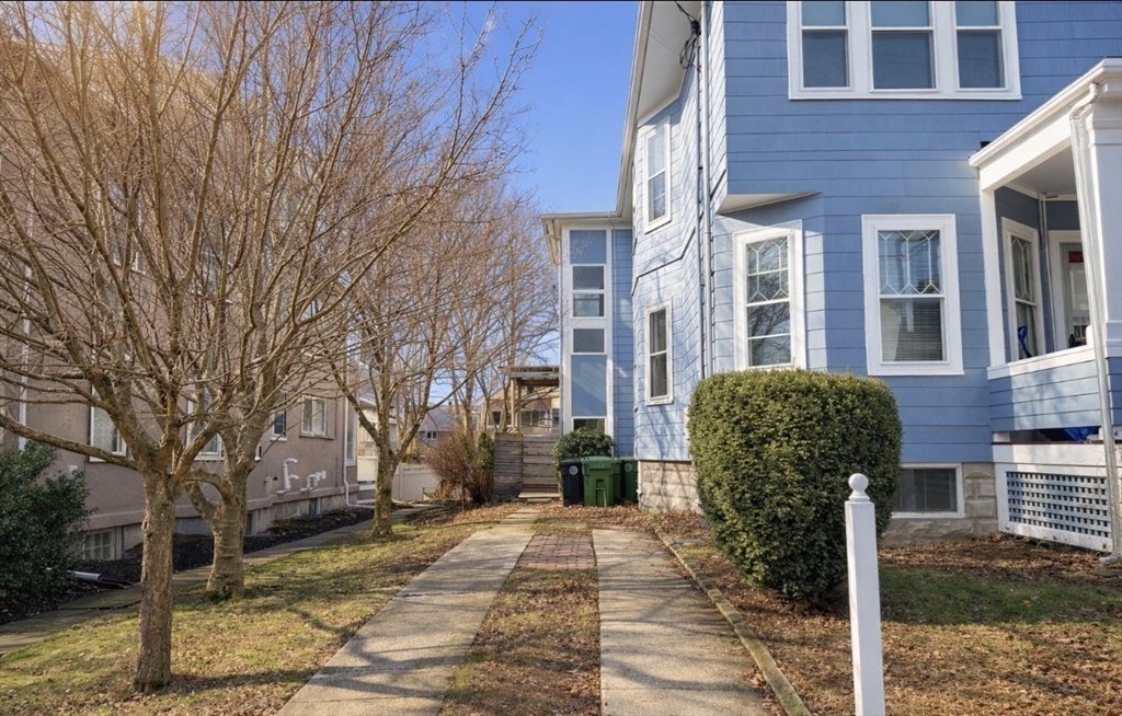 172 Maplewood Street, Unit 172 Watertown, MA 02472 - Photo 29 of 29 a view of a brick building next to a yard