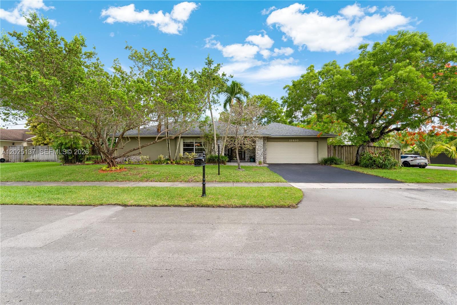 11480 Southwest 96th Terrace Miami, FL 33176 - Photo 42 of 54 a view of a house with a big yard and large trees