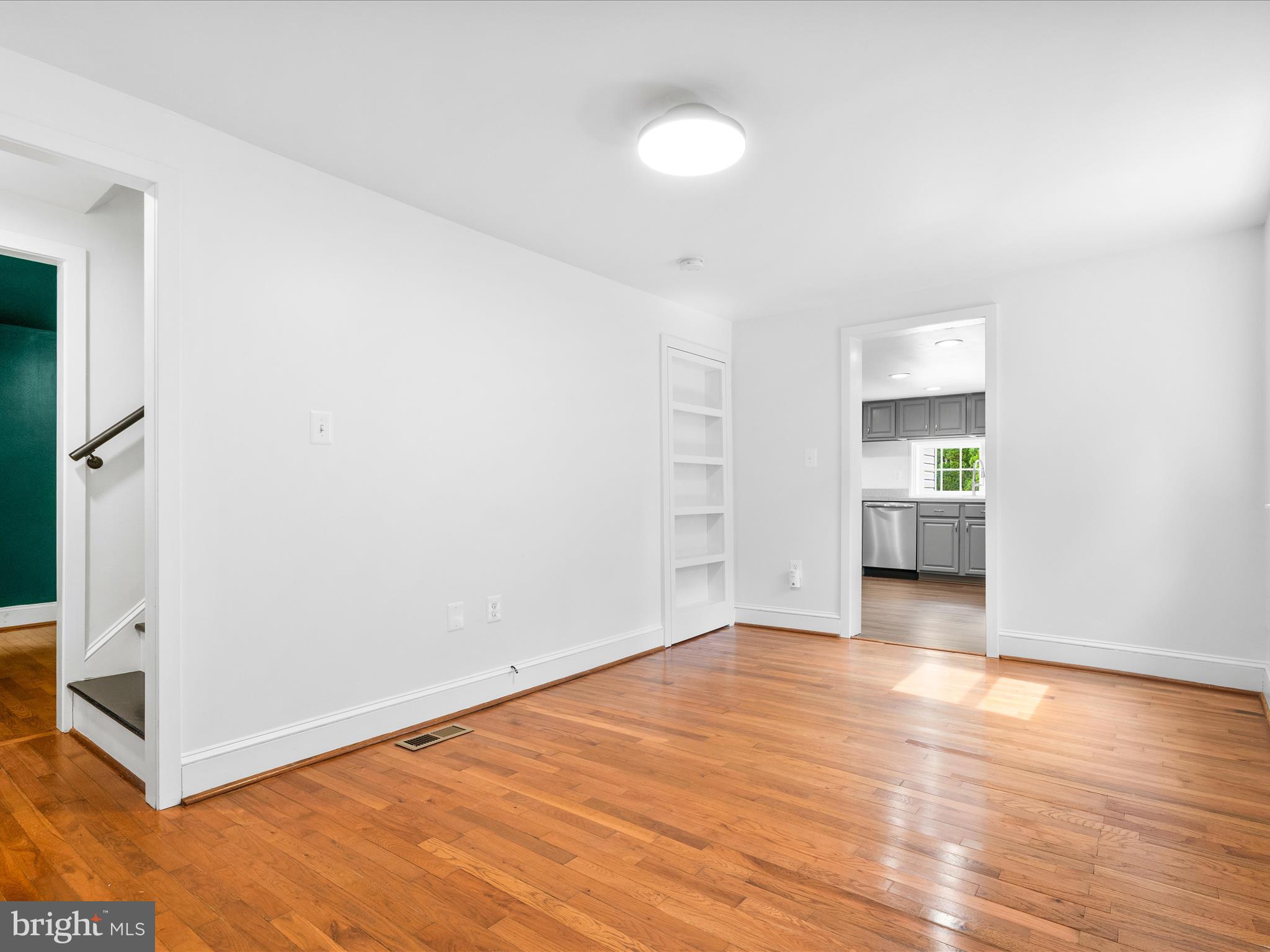 4417 Reels Mill Road Frederick, MD 21704 - Photo 12 of 64 an empty room with wooden floor and windows