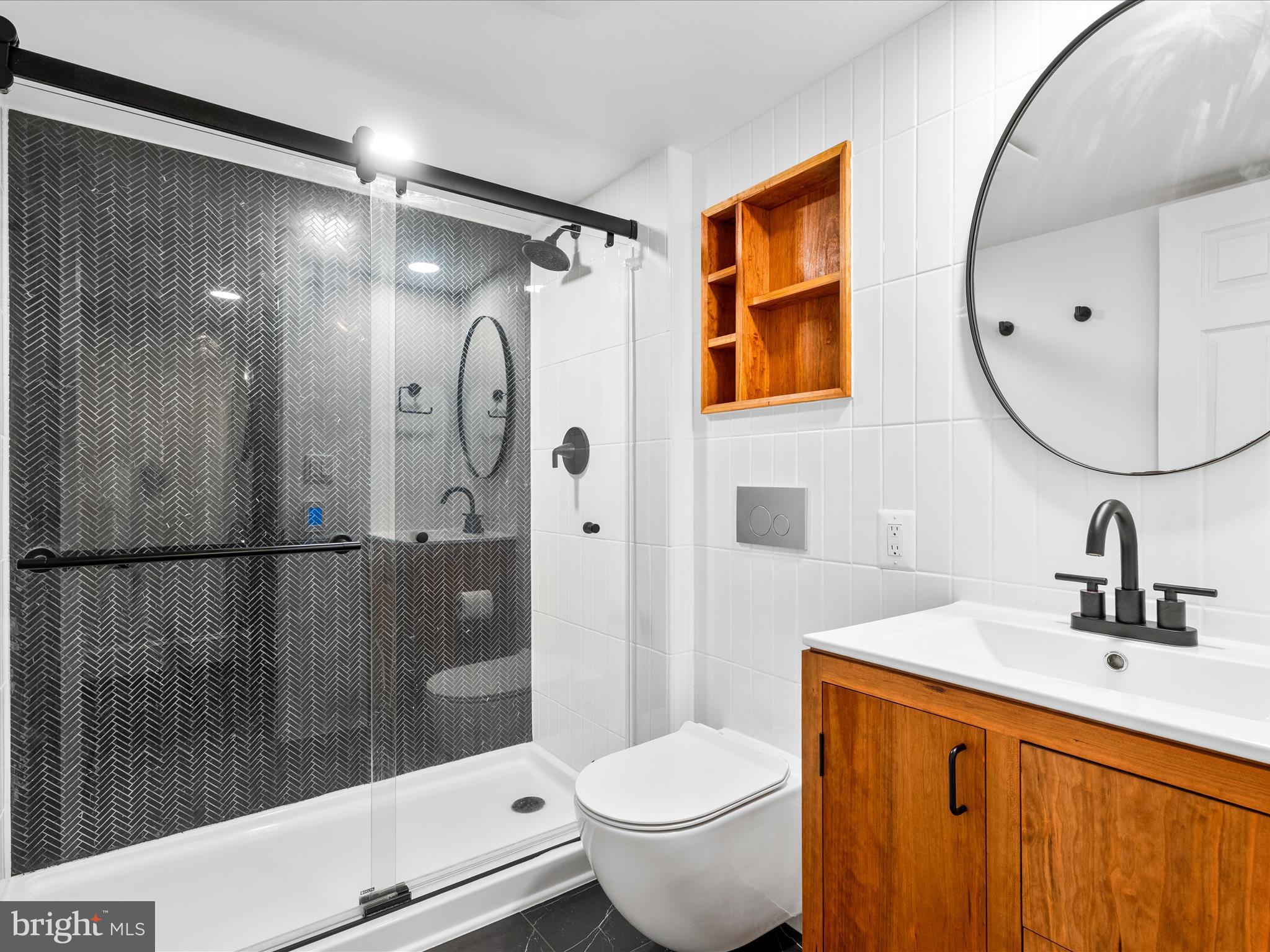 4417 Reels Mill Road Frederick, MD 21704 - Photo 23 of 64 a bathroom with a sink a toilet and shower