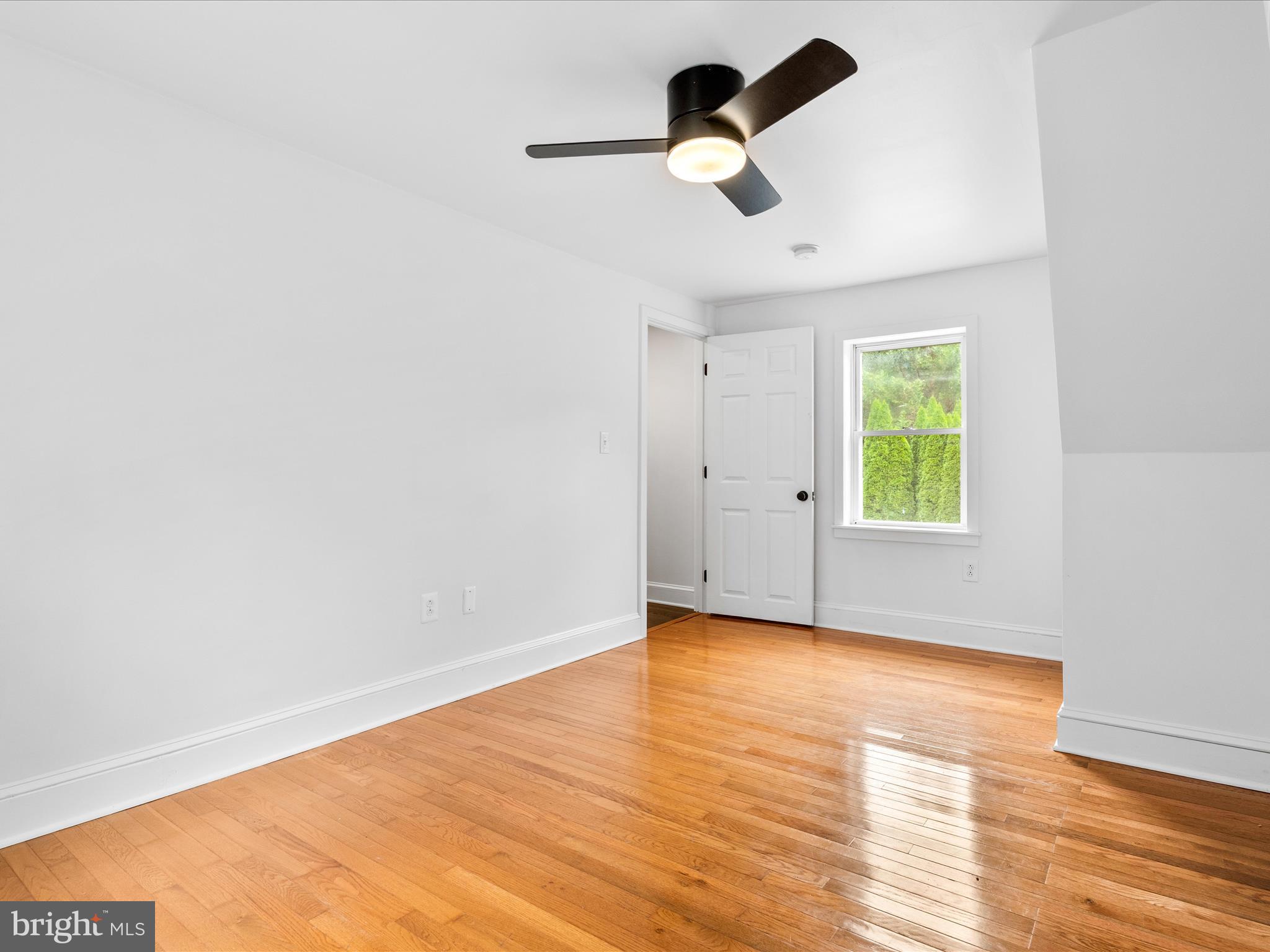 4417 Reels Mill Road Frederick, MD 21704 - Photo 27 of 64 an empty room with a window and a ceiling fan