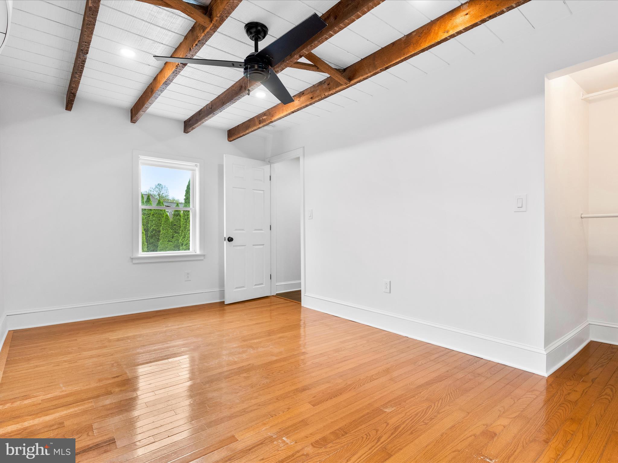 4417 Reels Mill Road Frederick, MD 21704 - Photo 30 of 64 a view of empty room with wooden floor and fan