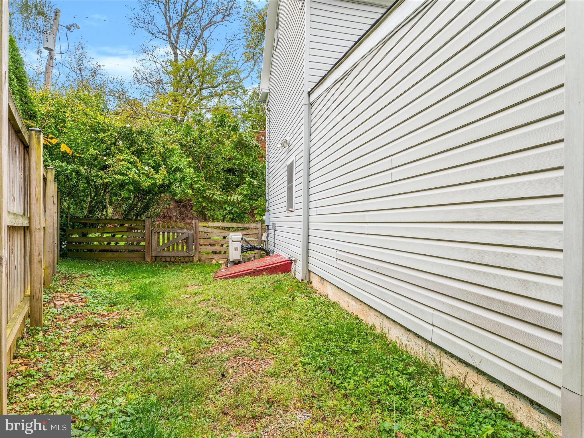 4417 Reels Mill Road Frederick, MD 21704 - Photo 36 of 64 a backyard of a house with table and chairs