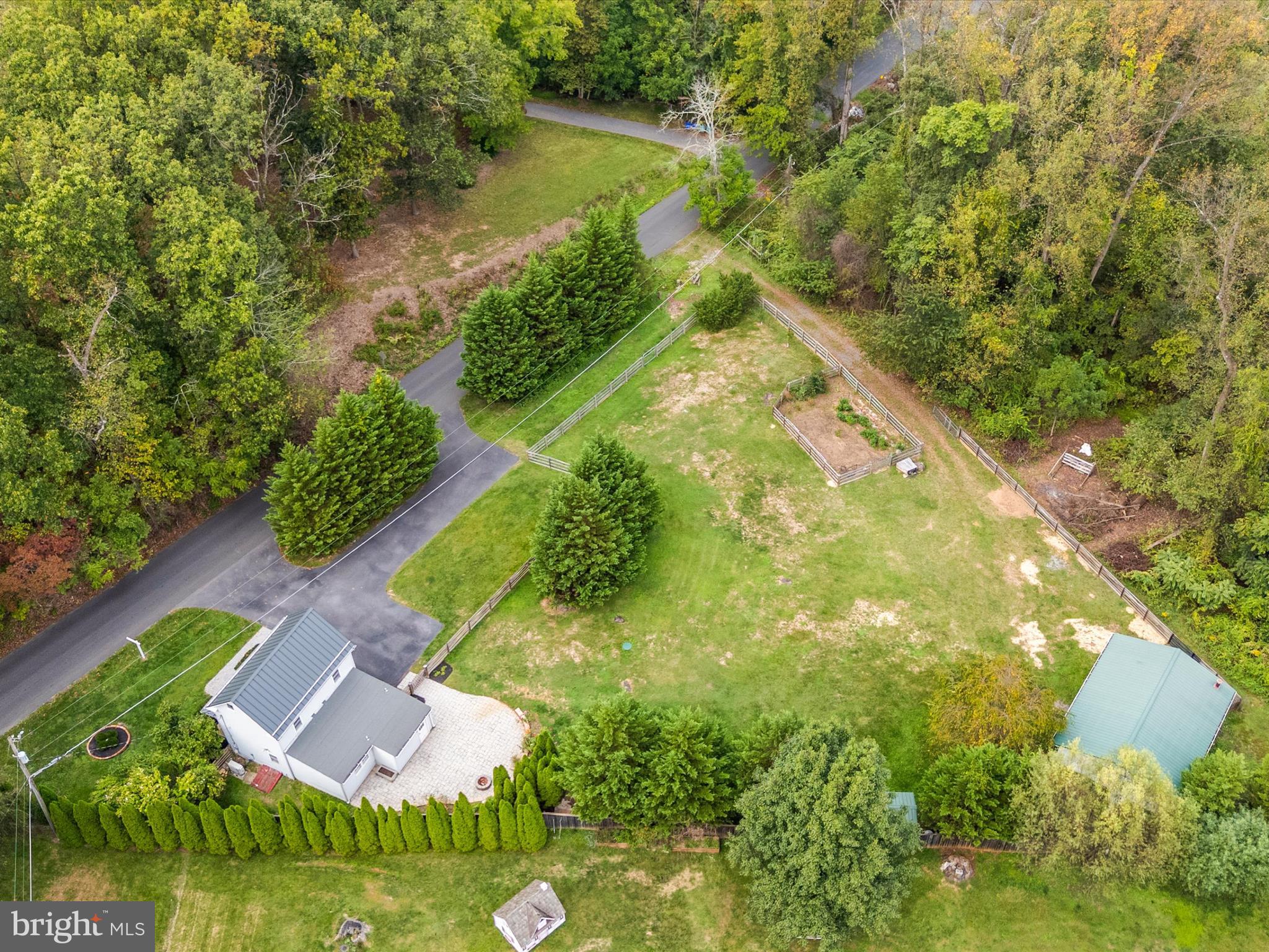 4417 Reels Mill Road Frederick, MD 21704 - Photo 56 of 64 an aerial view of residential house with outdoor space and lake view
