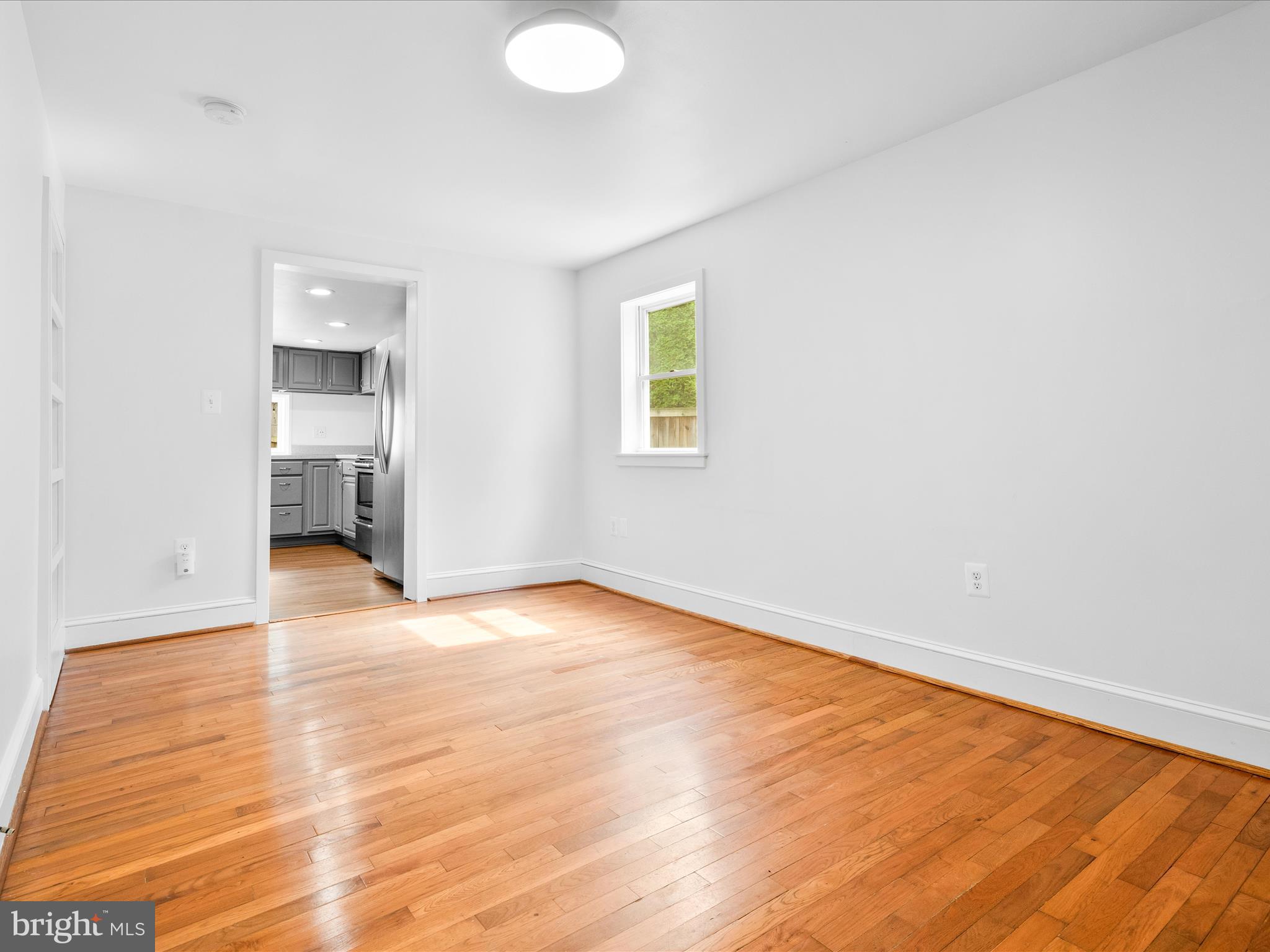 4417 Reels Mill Road Frederick, MD 21704 - Photo 10 of 64 a view of empty room with wooden floor and fan
