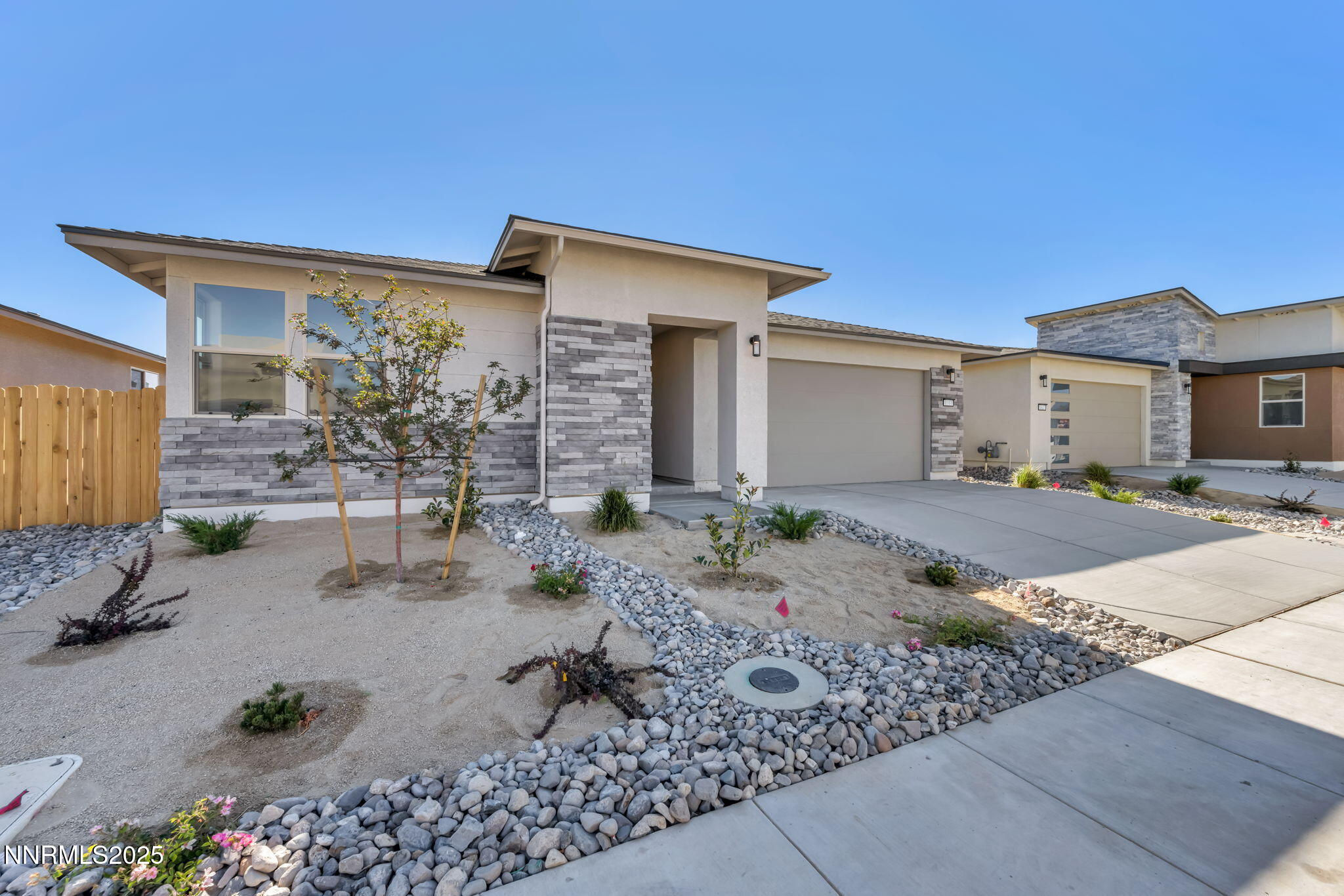 1333 Nebula Road, Unit HOMESITE 45 Carson City, NV 89705 - Photo 1 of 19 a front view of a house with garden