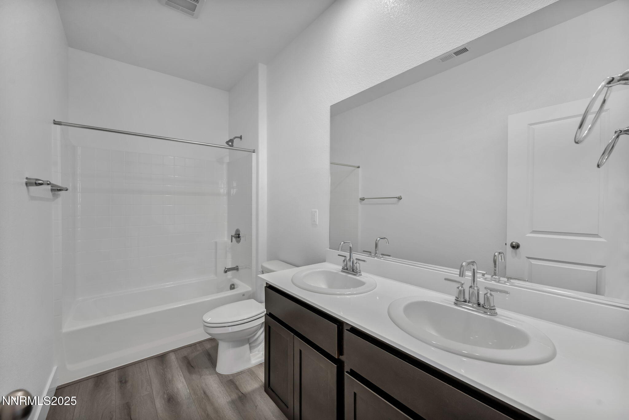 1333 Nebula Road, Unit HOMESITE 45 Carson City, NV 89705 - Photo 13 of 19 a bathroom with a sink a toilet and shower