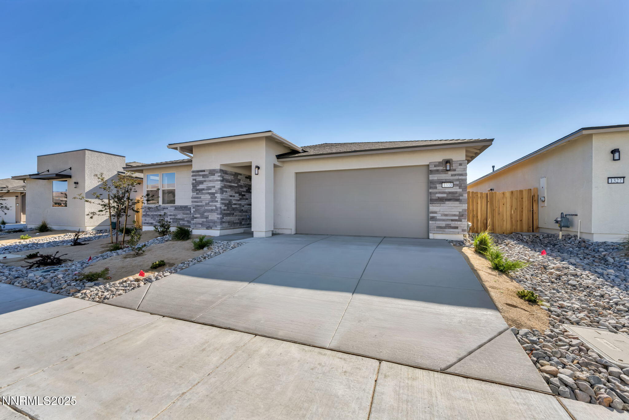1333 Nebula Road, Unit HOMESITE 45 Carson City, NV 89705 - Photo 2 of 19 a front view of a house with a yard