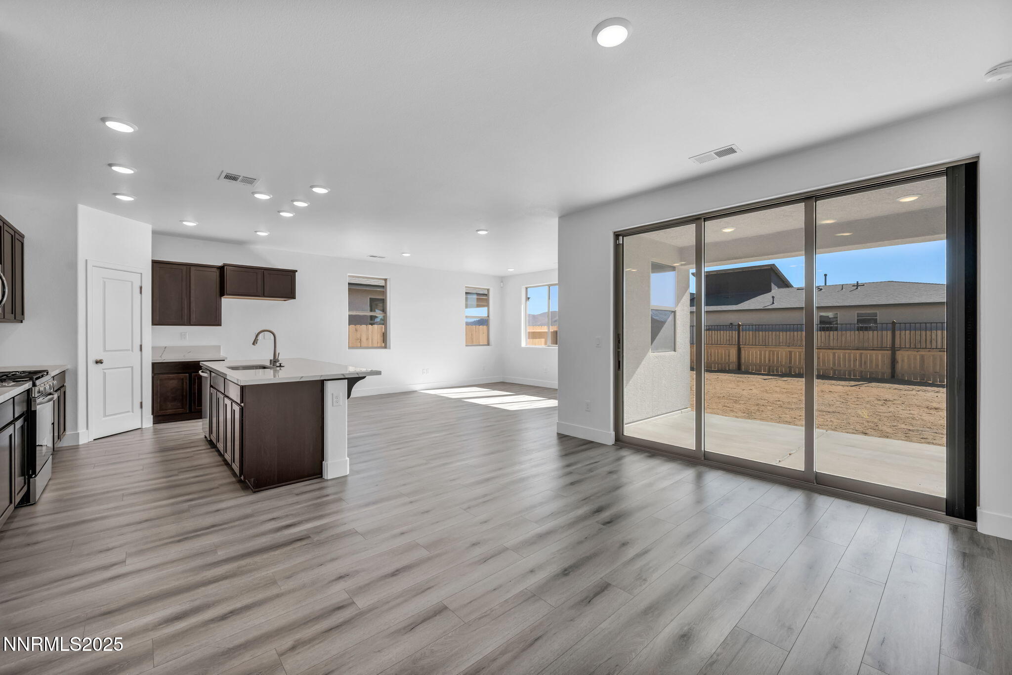 1333 Nebula Road, Unit HOMESITE 45 Carson City, NV 89705 - Photo 6 of 19 a view of kitchen with stainless steel appliances wooden floor and large window
